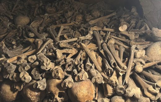 how many bodies are in the Paris Catacombs - Historic Paris Catacombs with bones and skulls lining the walls